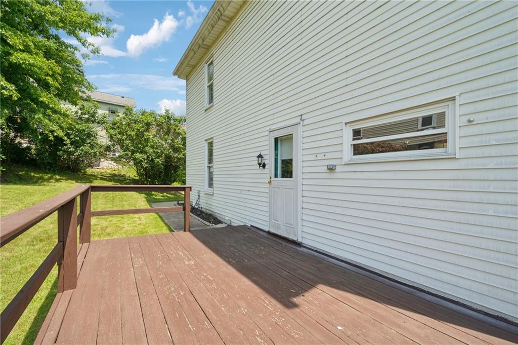 600 Scott Street Penn, PA 15675 - Photo 28 of 33 a view of a balcony with wooden floor and large trees