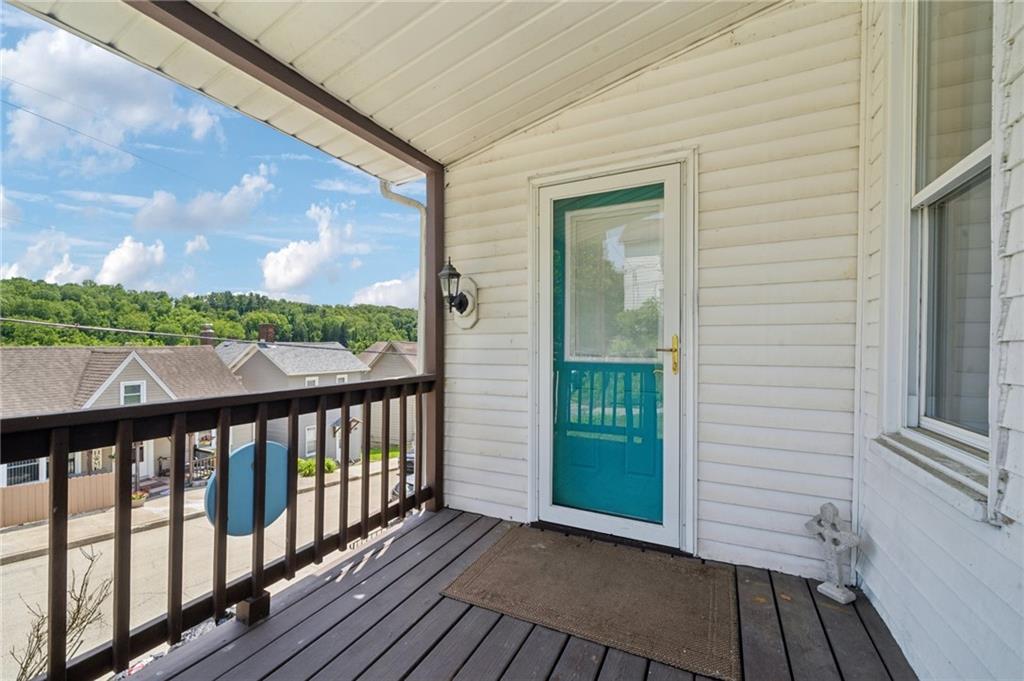 600 Scott Street Penn, PA 15675 - Photo 3 of 33 a view of a balcony with wooden floor