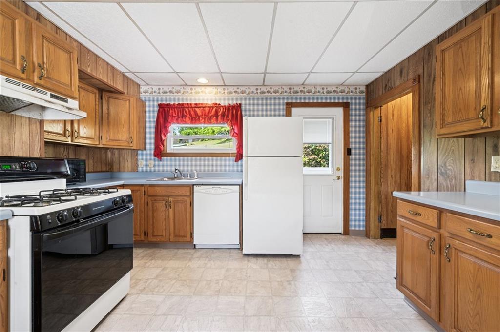600 Scott Street Penn, PA 15675 - Photo 10 of 33 a kitchen with stainless steel appliances granite countertop a stove a sink and a refrigerator