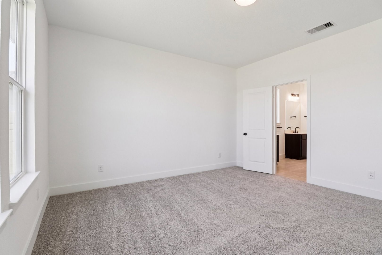 14470 Trumpet Lane Splendora, TX 77372 - Photo 12 of 27 an empty room with windows and closet