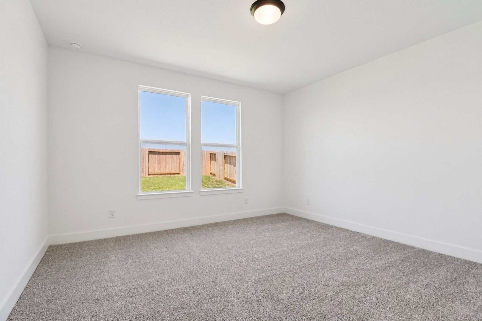 14470 Trumpet Lane Splendora, TX 77372 - Photo 13 of 27 an empty room with windows