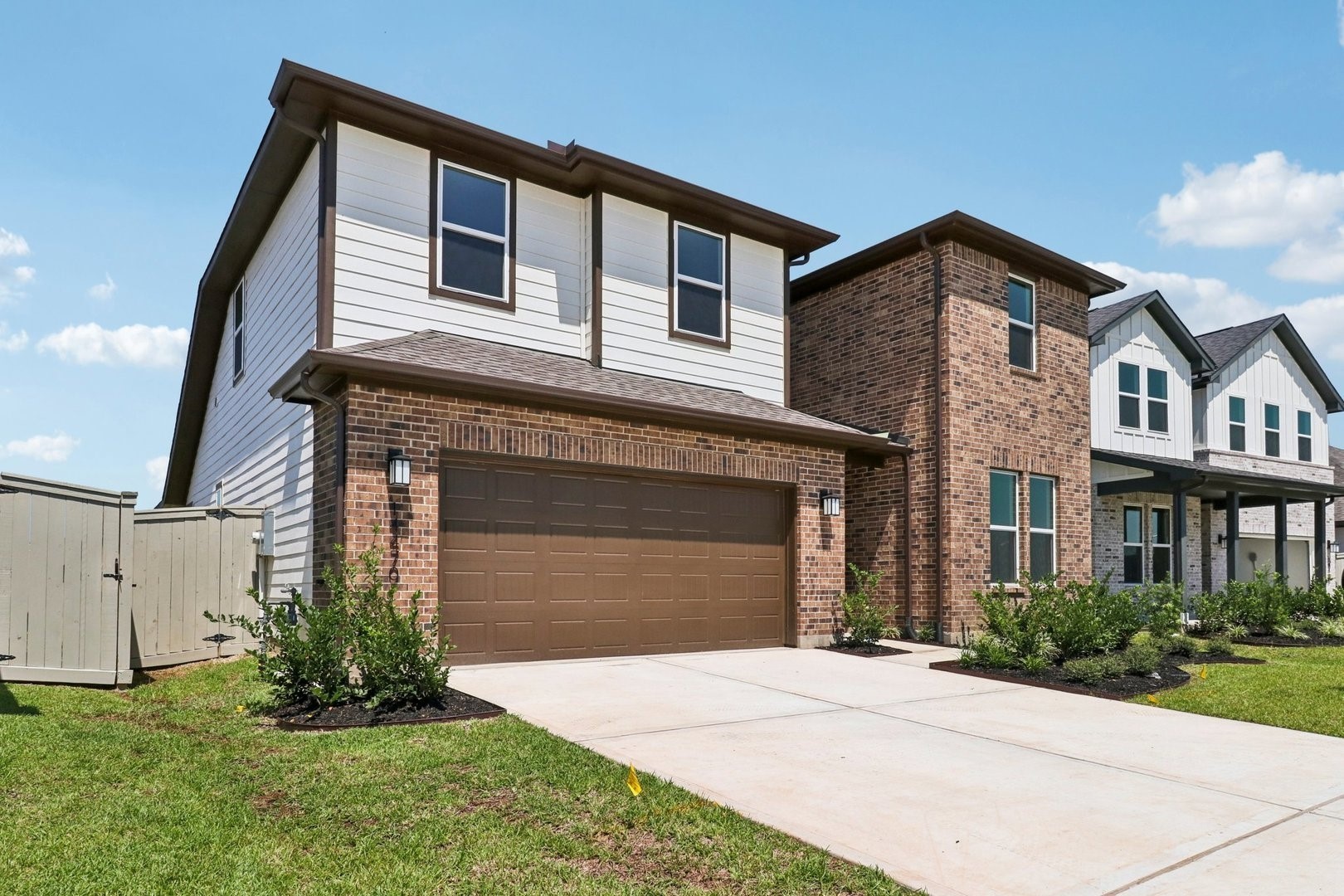 14470 Trumpet Lane Splendora, TX 77372 - Photo 2 of 27 a front view of a house with a garden and yard