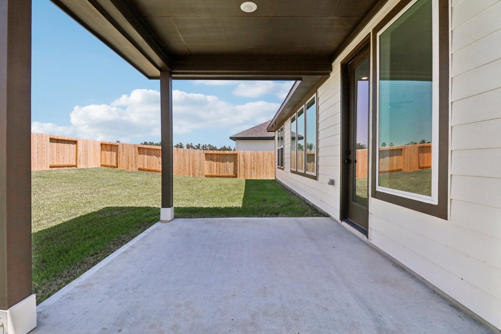 14470 Trumpet Lane Splendora, TX 77372 - Photo 21 of 27 a view of a house with a yard
