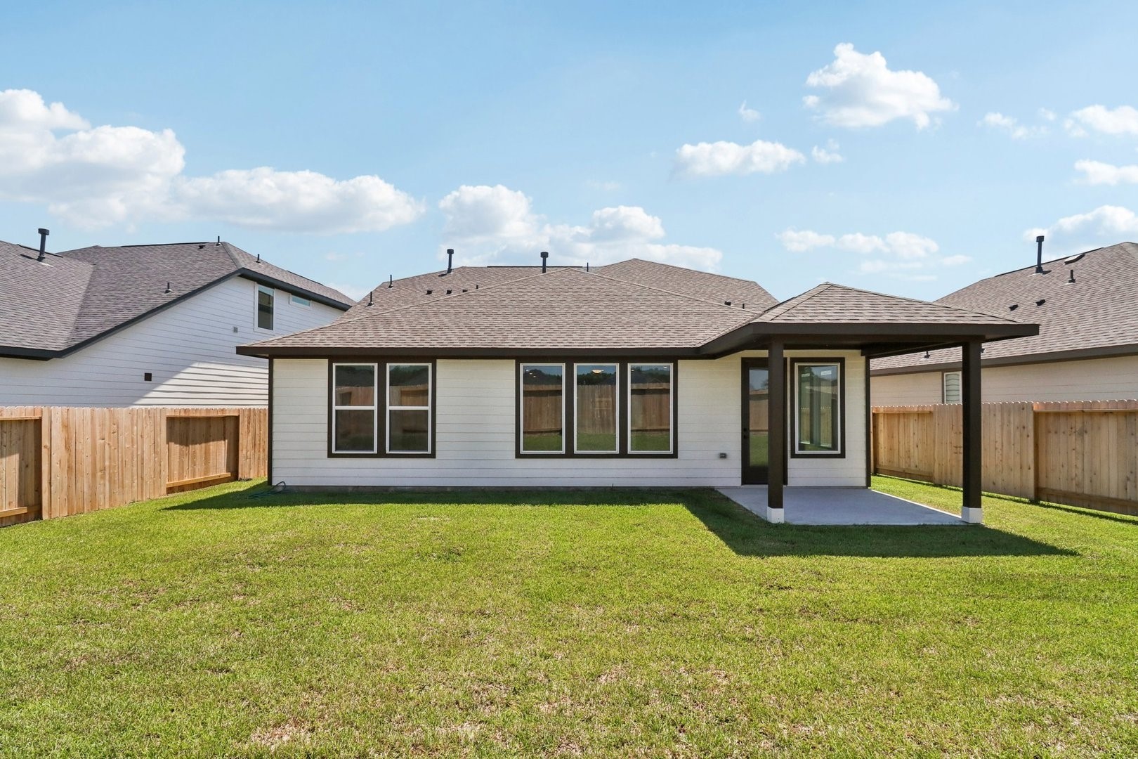14470 Trumpet Lane Splendora, TX 77372 - Photo 23 of 27 a front view of a house with a yard and porch