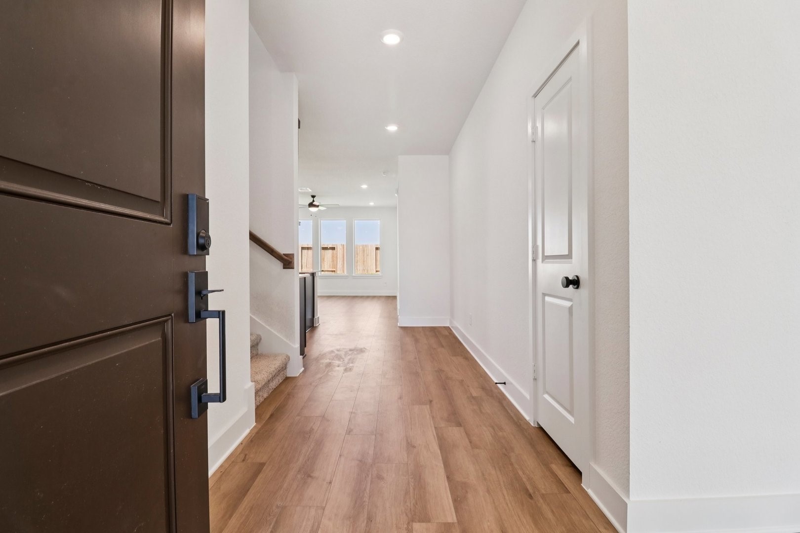 14470 Trumpet Lane Splendora, TX 77372 - Photo 4 of 27 a view of a hallway with wooden floor and staircase