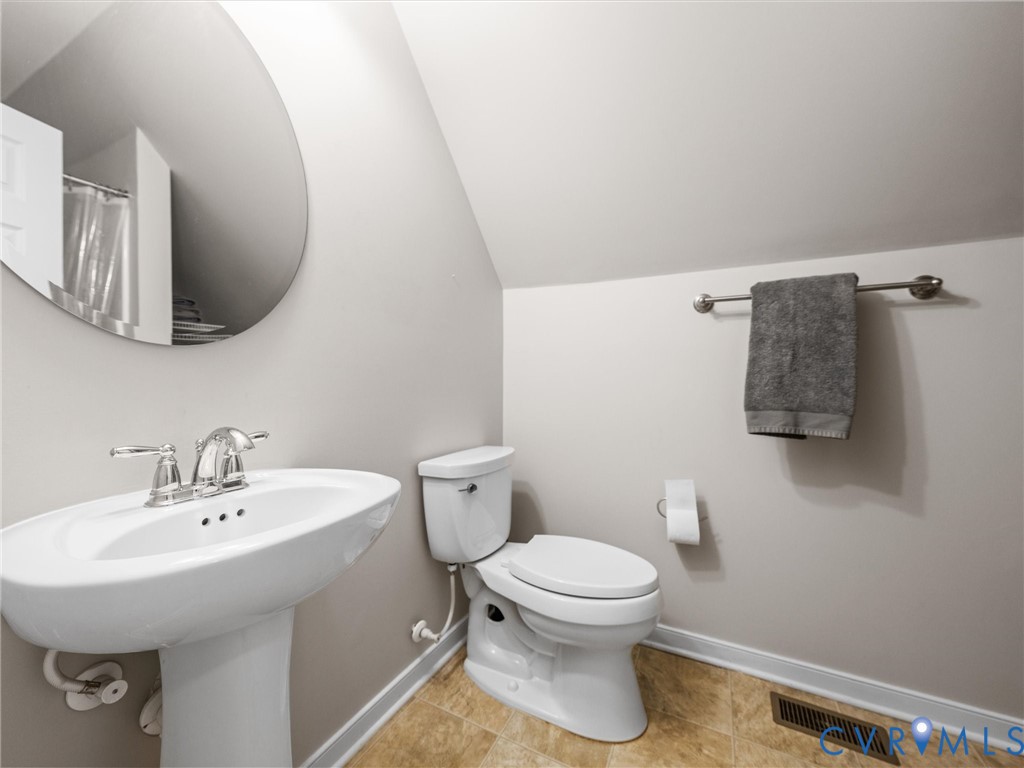 10824 Avening Road Chesterfield, VA 23832 - Photo 37 of 47 a white toilet sitting next to a bathroom sink