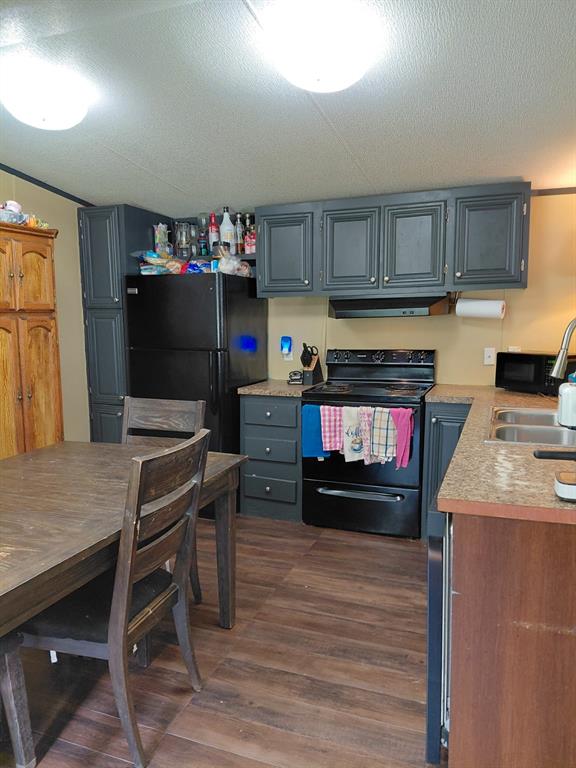 10855 Winrock Road Mooringsport, LA 71060 - Photo 11 of 21 a room with furniture and a wooden floor
