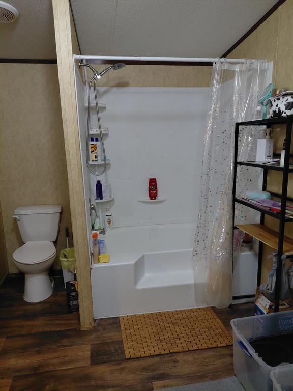 10855 Winrock Road Mooringsport, LA 71060 - Photo 15 of 21 a bathroom with a tub and a toilet