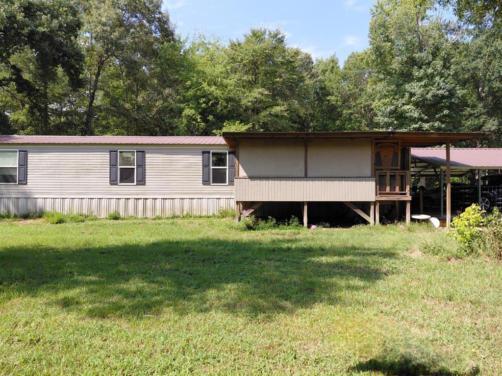 10855 Winrock Road Mooringsport, LA 71060 - Photo 6 of 21 a house view with a garden space