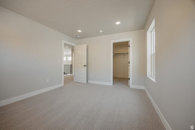 5910 Canyon Rim Road, Unit 619 Lehi, UT 84048 - Photo 44 of 52 Wall-to-wall carpeting, recessed lighting, and a window with white trim