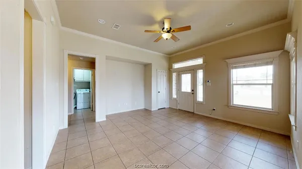 a view of an empty room with a window