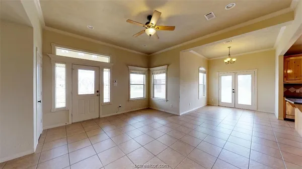 a view of an entryway with a chandelier