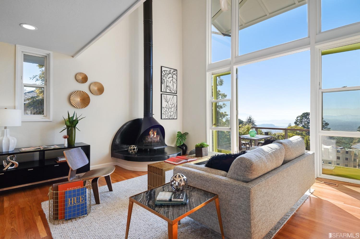 a living room with furniture a rug and a large window