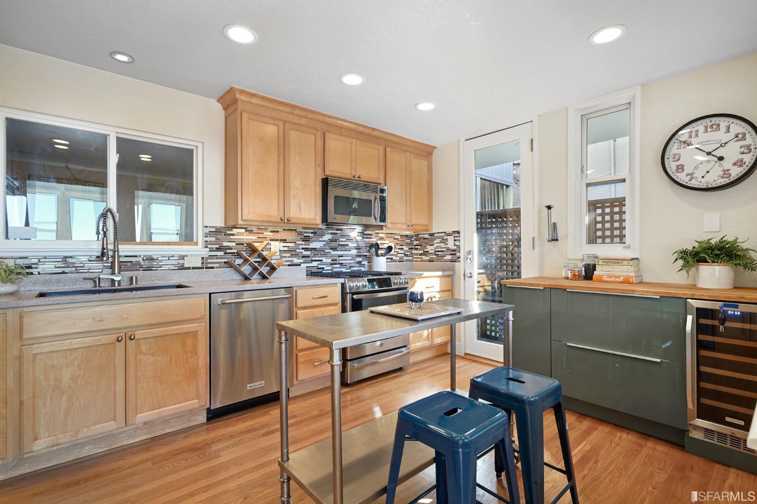31 Avenida Drive Berkeley, CA 94708 - Photo 14 of 32 a kitchen with stainless steel appliances granite countertop a stove and cabinets