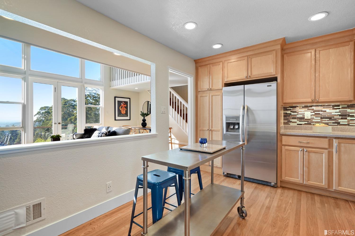 31 Avenida Drive Berkeley, CA 94708 - Photo 15 of 32 a kitchen with stainless steel appliances granite countertop a refrigerator a stove and a wooden floors