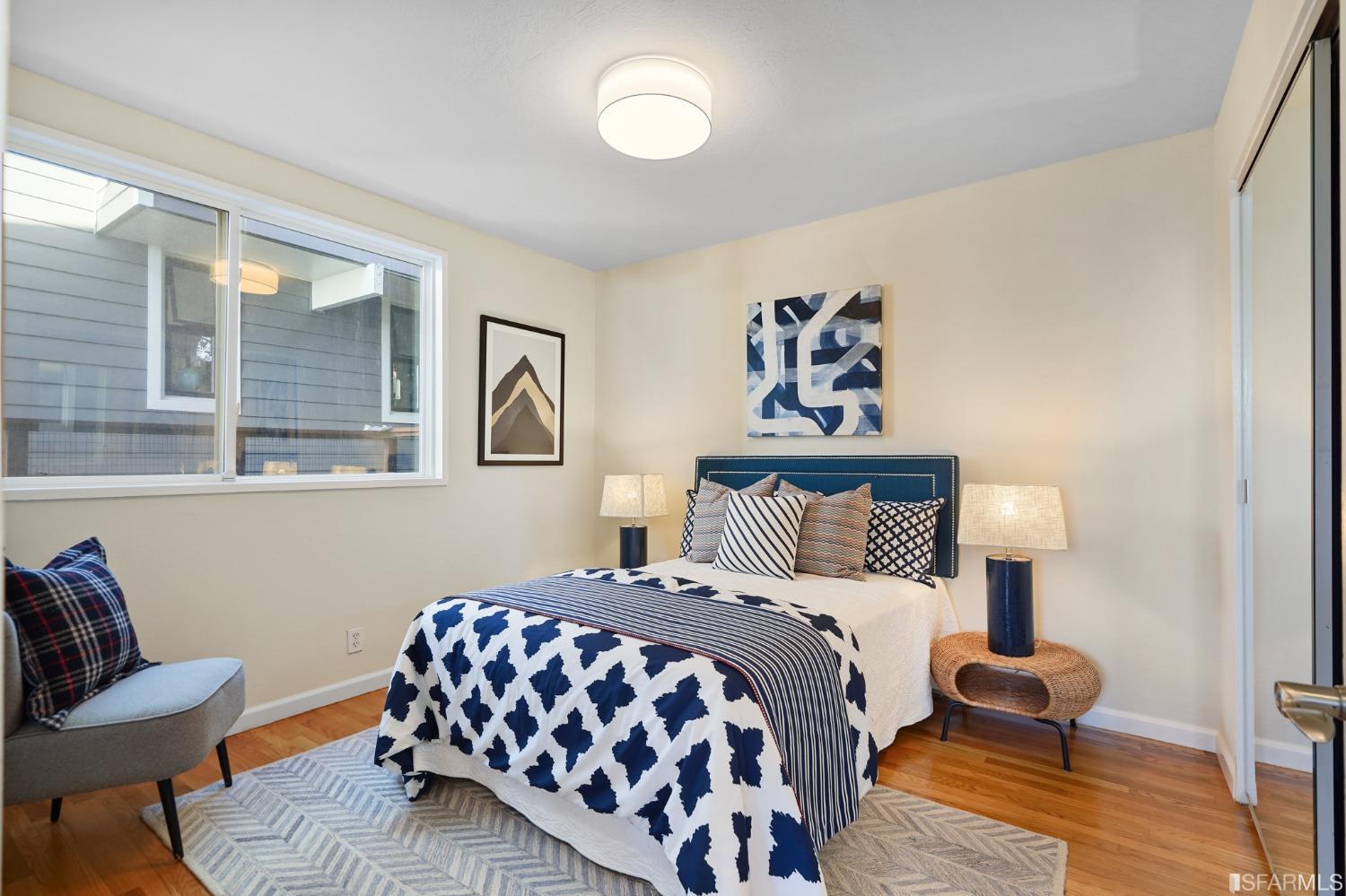 31 Avenida Drive Berkeley, CA 94708 - Photo 24 of 32 a bedroom with a bed and wooden floor