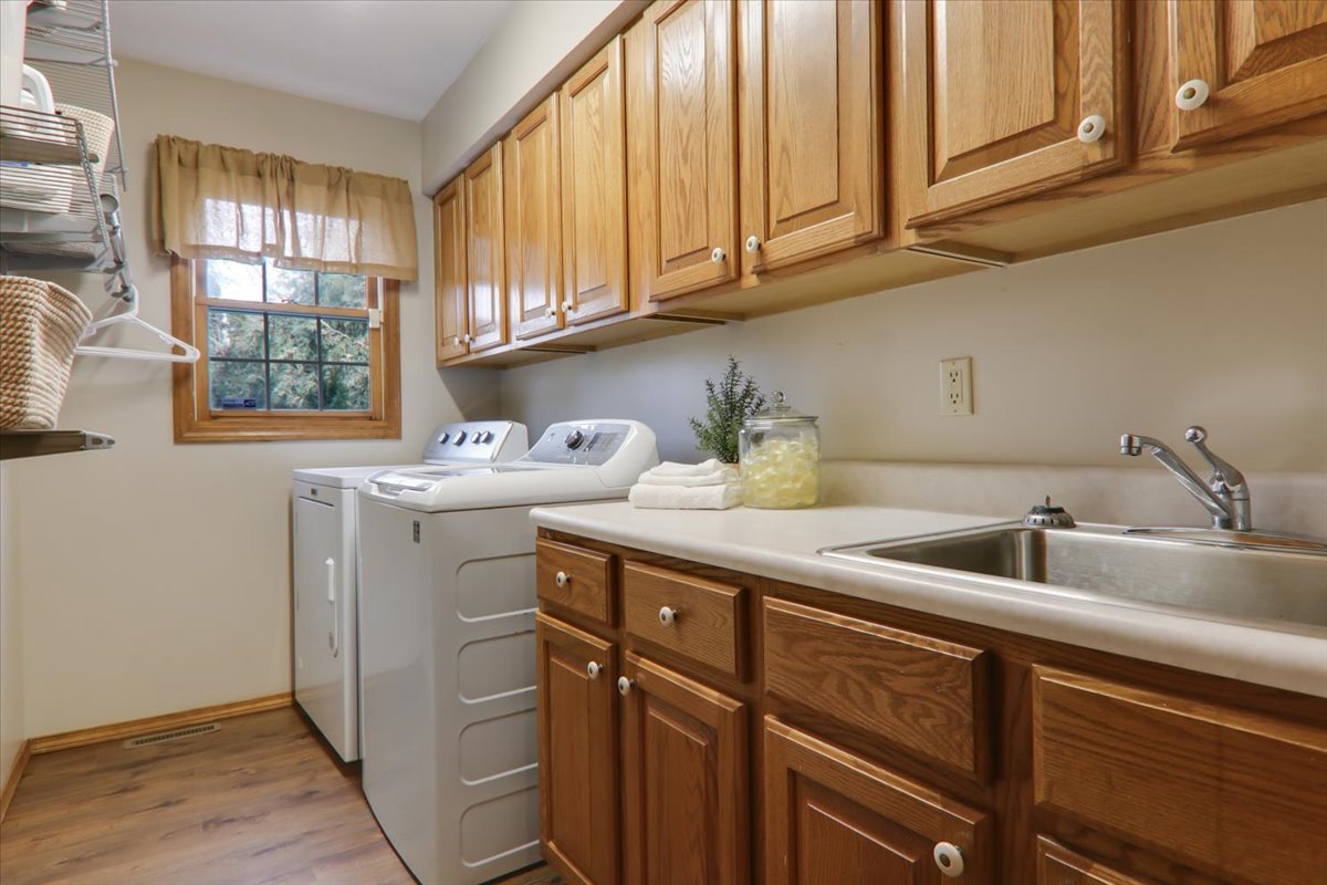 8 Minks Court Bloomington, IL 61704 - Photo 13 of 40 a kitchen with a sink cabinets and window