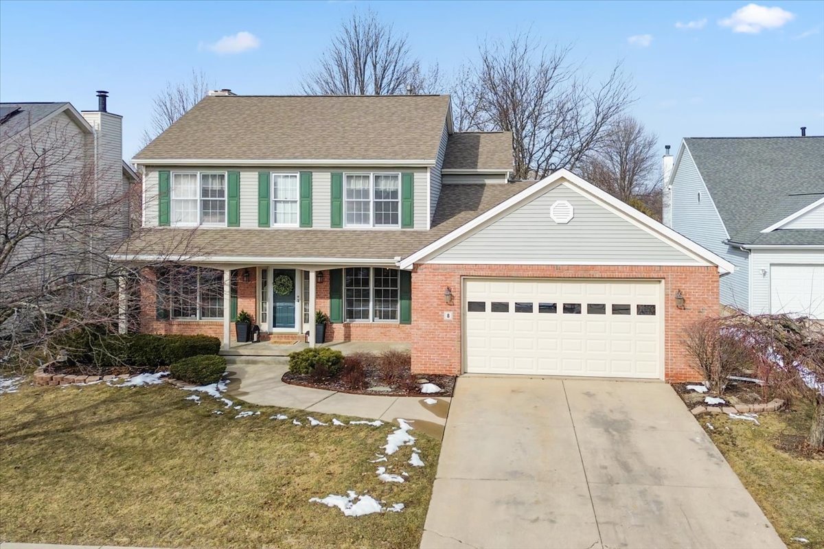 8 Minks Court Bloomington, IL 61704 - Photo 2 of 40 a sign on the side of a building