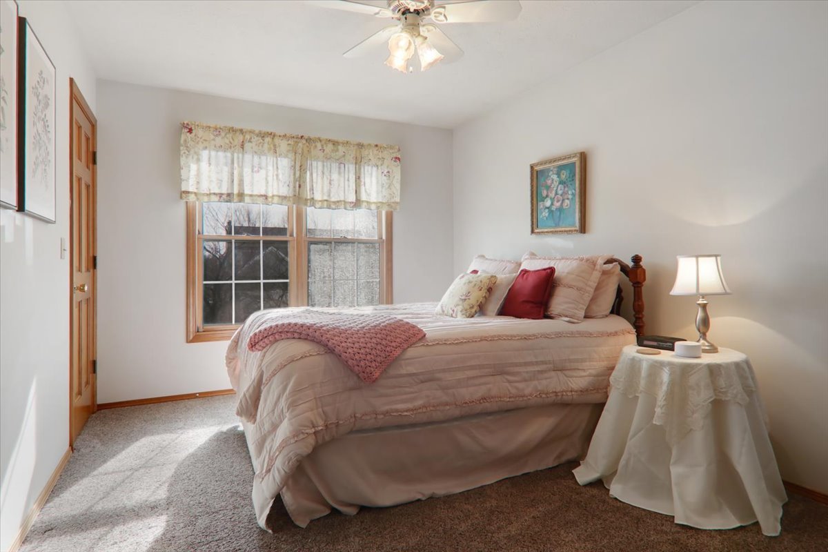 8 Minks Court Bloomington, IL 61704 - Photo 21 of 40 a bedroom with a bed and a window