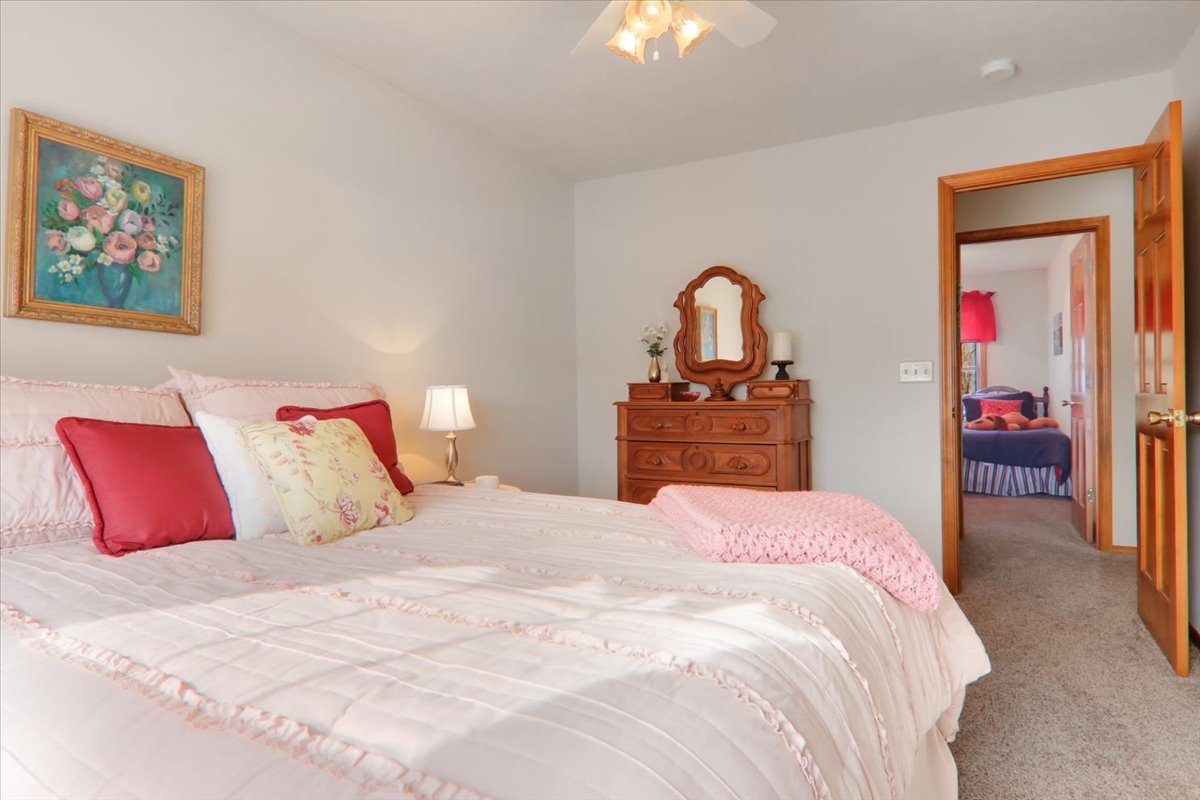 8 Minks Court Bloomington, IL 61704 - Photo 22 of 40 a bedroom with a bed and a dresser