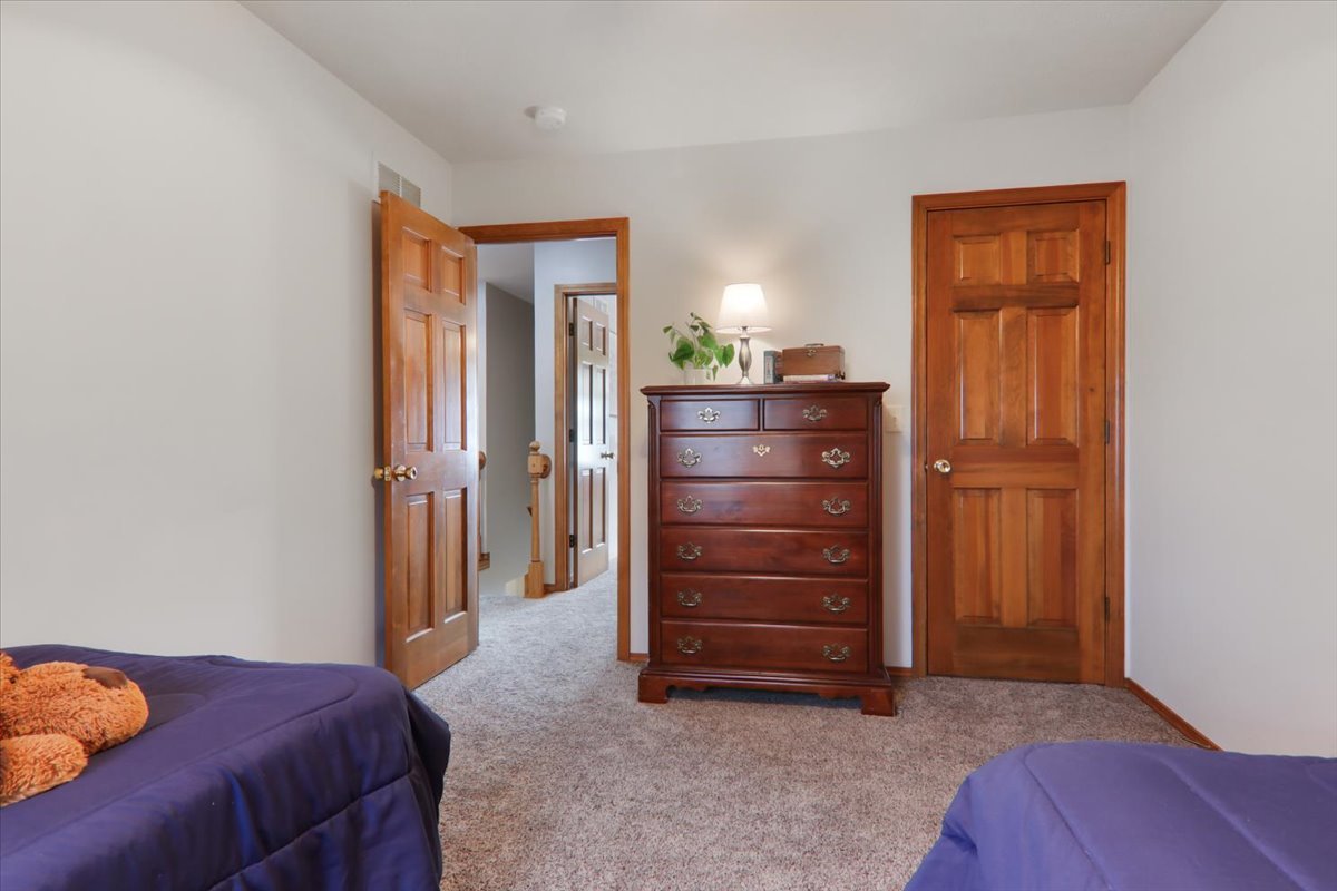 8 Minks Court Bloomington, IL 61704 - Photo 24 of 40 a bedroom with a bed and a dresser