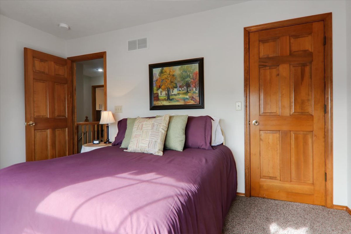 8 Minks Court Bloomington, IL 61704 - Photo 26 of 40 a bed room with a bed and a painting