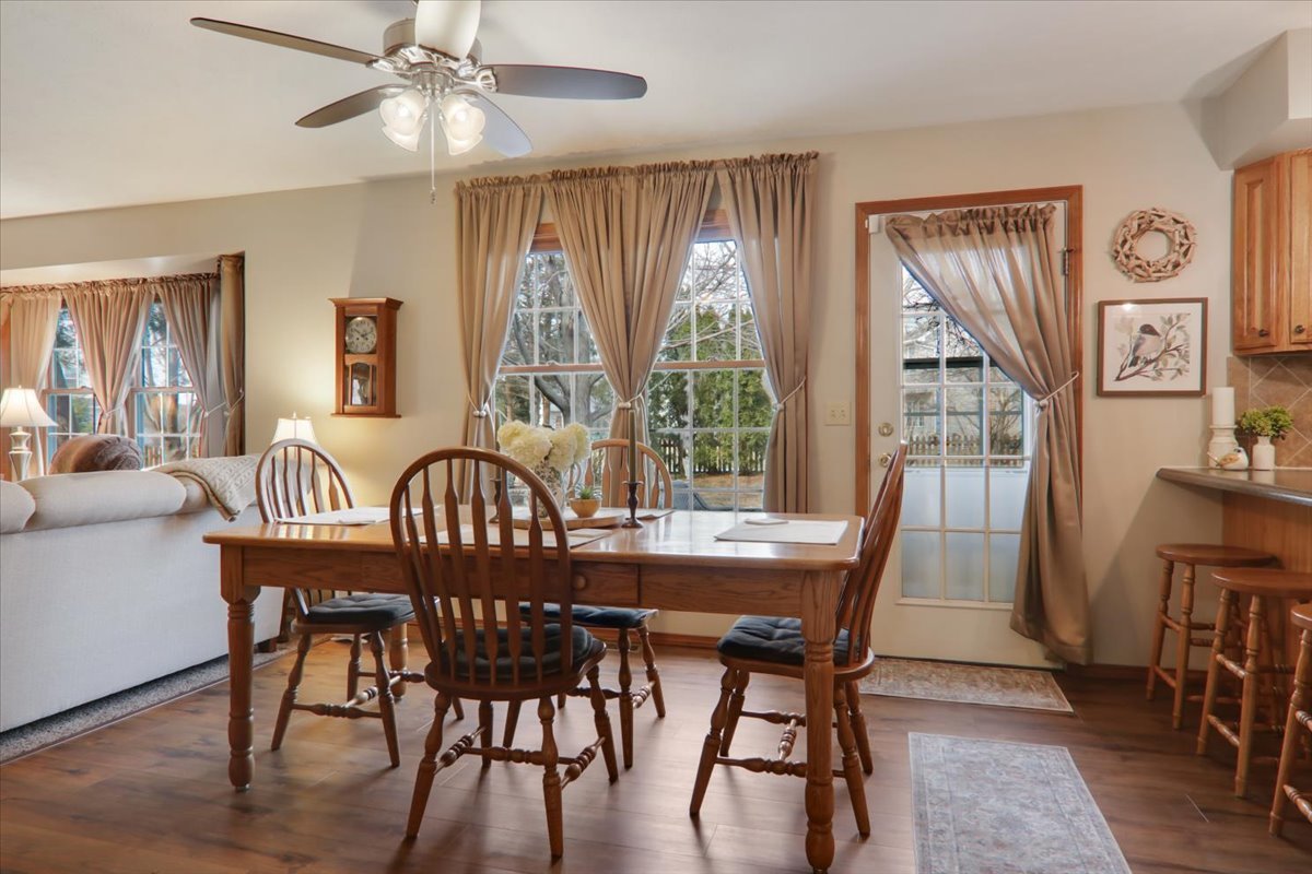 8 Minks Court Bloomington, IL 61704 - Photo 9 of 40 a view of a dining room with furniture window and wooden floor