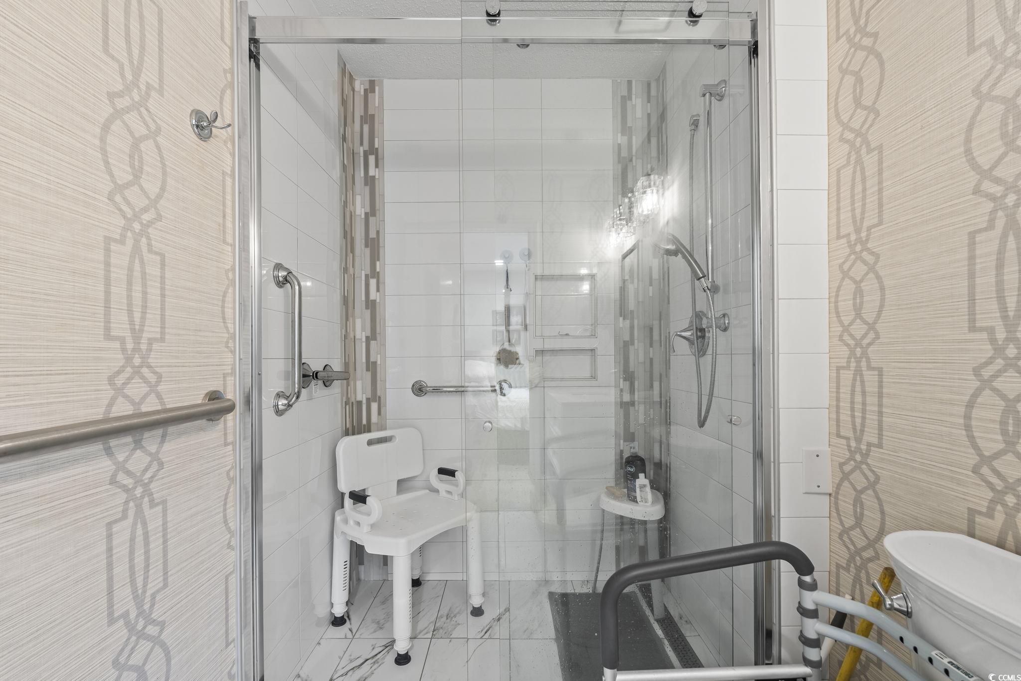 5001 Little River Road, Unit W102 Myrtle Beach, SC 29577 - Photo 17 of 38 Bathroom with a stall shower