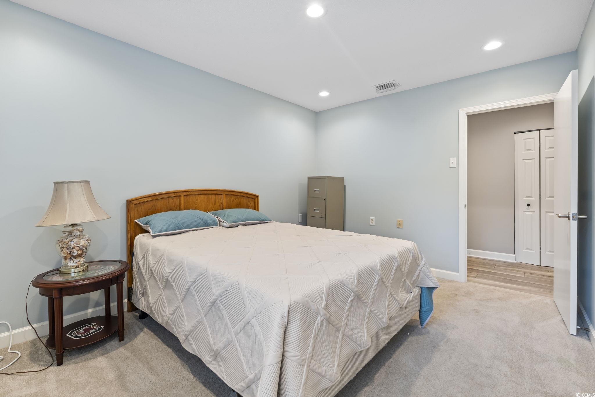 5001 Little River Road, Unit W102 Myrtle Beach, SC 29577 - Photo 23 of 38 Bedroom featuring recessed lighting and light carpet