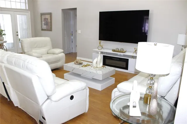 a living room with furniture and a flat screen tv