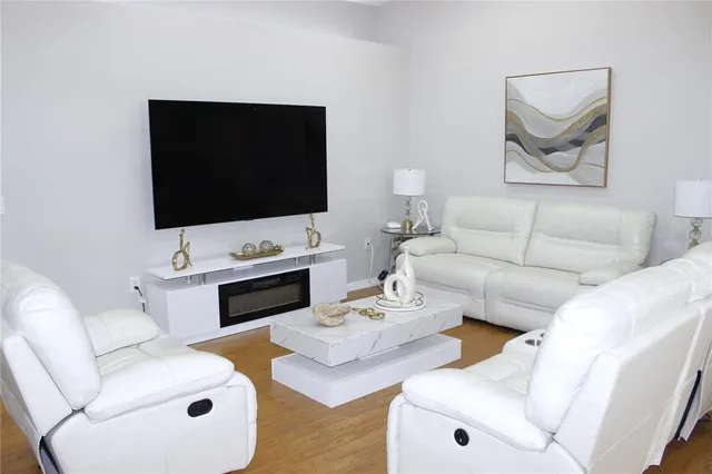 a living room with furniture and a window