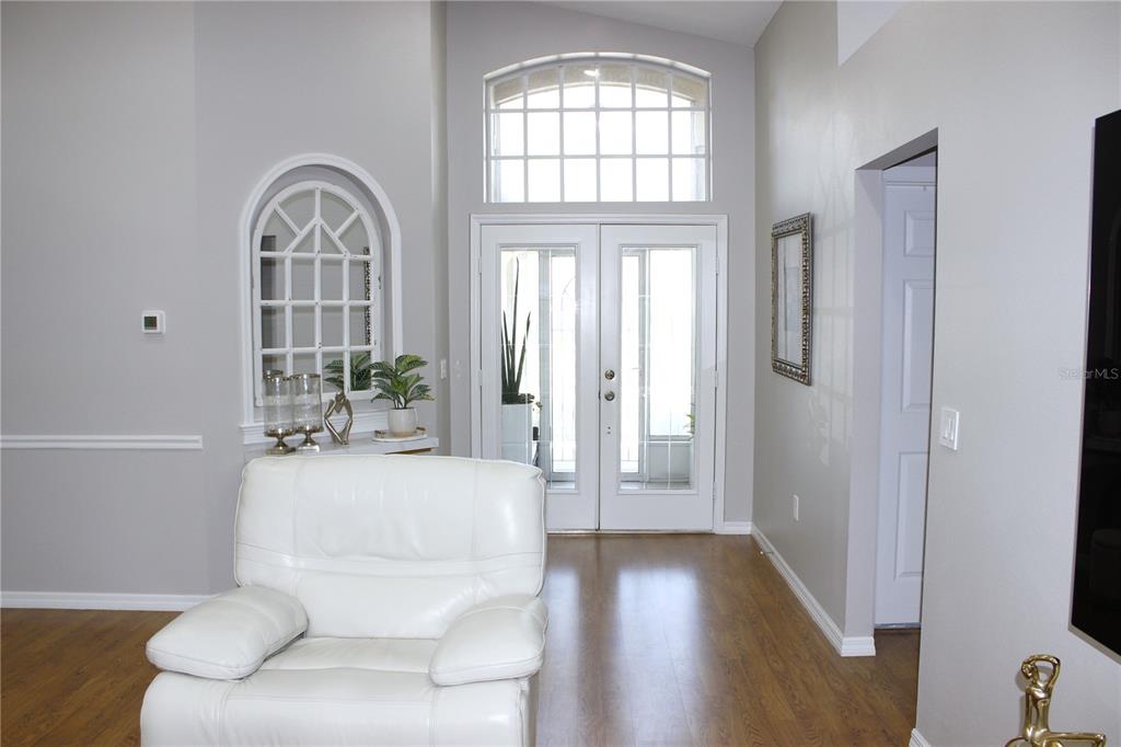 13451 Knotty Lane Hudson, FL 34669 - Photo 15 of 34 a living room with furniture and a window