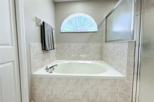 a bathroom with a bathtub and a sink