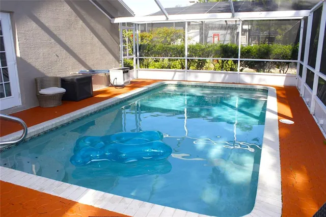 a view of swimming pool from a patio
