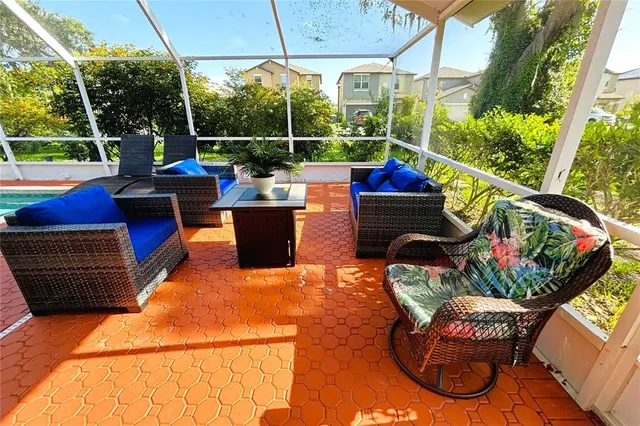 an aerial view of a house with a yard and garden