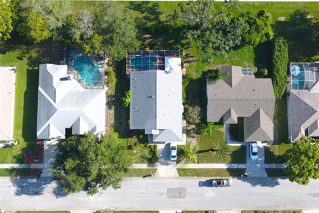 13451 Knotty Lane Hudson, FL 34669 - Photo 31 of 34 an aerial view of a house with a yard and garden