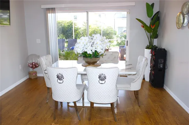 a view of a dining room with furniture window and outside view