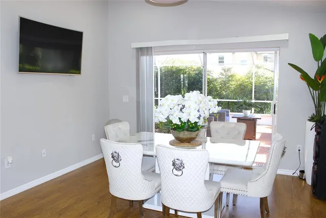 a kitchen with a sink cabinets and wooden floor