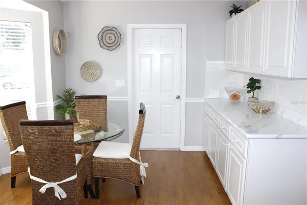 a view of a dining room with furniture and window