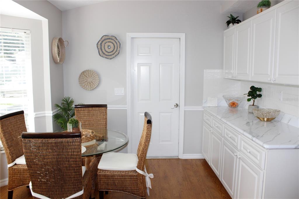 13451 Knotty Lane Hudson, FL 34669 - Photo 8 of 34 a view of a dining room with furniture and window