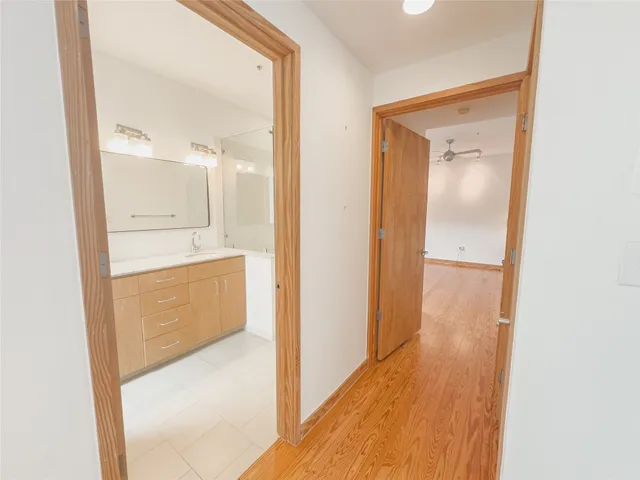 a view of a bathroom from a hallway