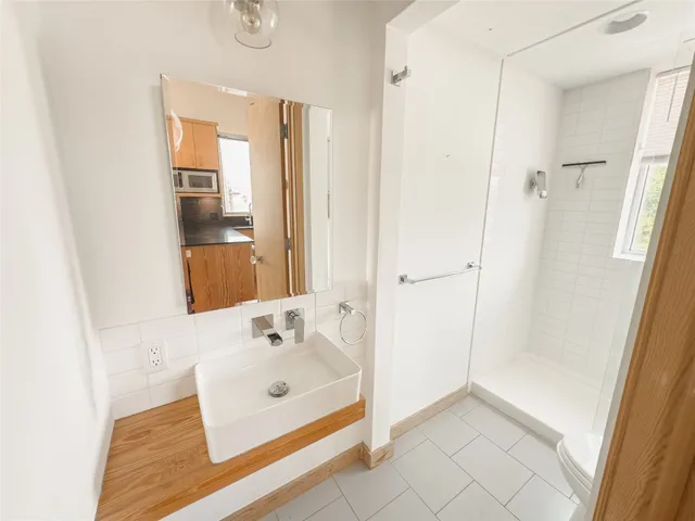 a bathroom with a sink and a window