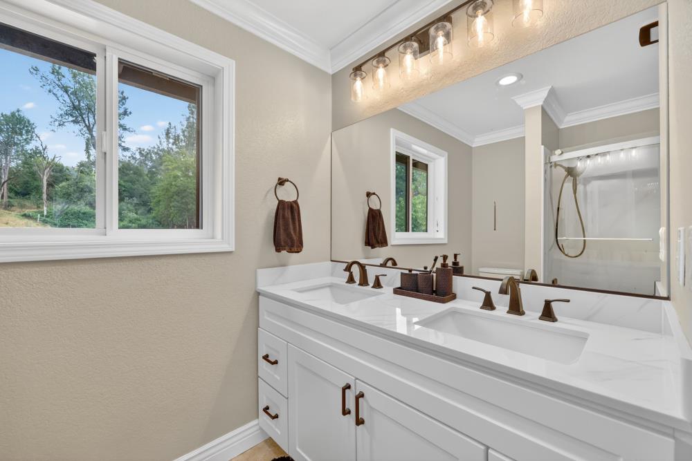 3340 Garden Bar Road Lincoln, CA 95648 - Photo 30 of 56 a bathroom with a double vanity sink window and a mirror