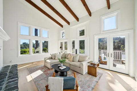 a view of a chair and tables on the roof deck