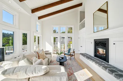 a view of a patio with couches table and chairs and potted plants