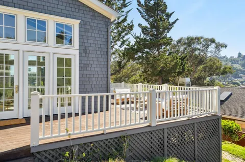 a bathroom with double vanity sinks a large mirror and a shower