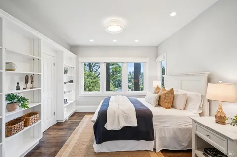 a view of a livingroom with furniture and a flat screen tv