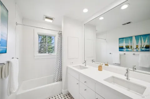 a view of a kitchen with a sink and large window