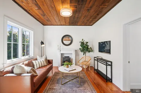 a front view of a house with a yard table and chairs