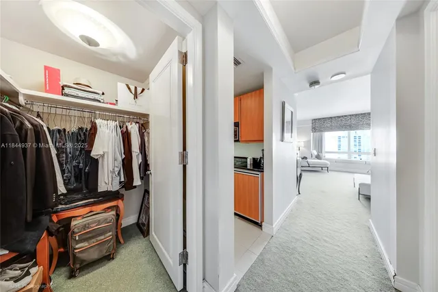 a view of swimming pool with chairs and table under an umbrella